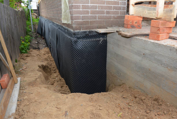 SJ Waterproofing Pros technician performing targeted Wet Basement Repair assessment in Kilbourne, OH